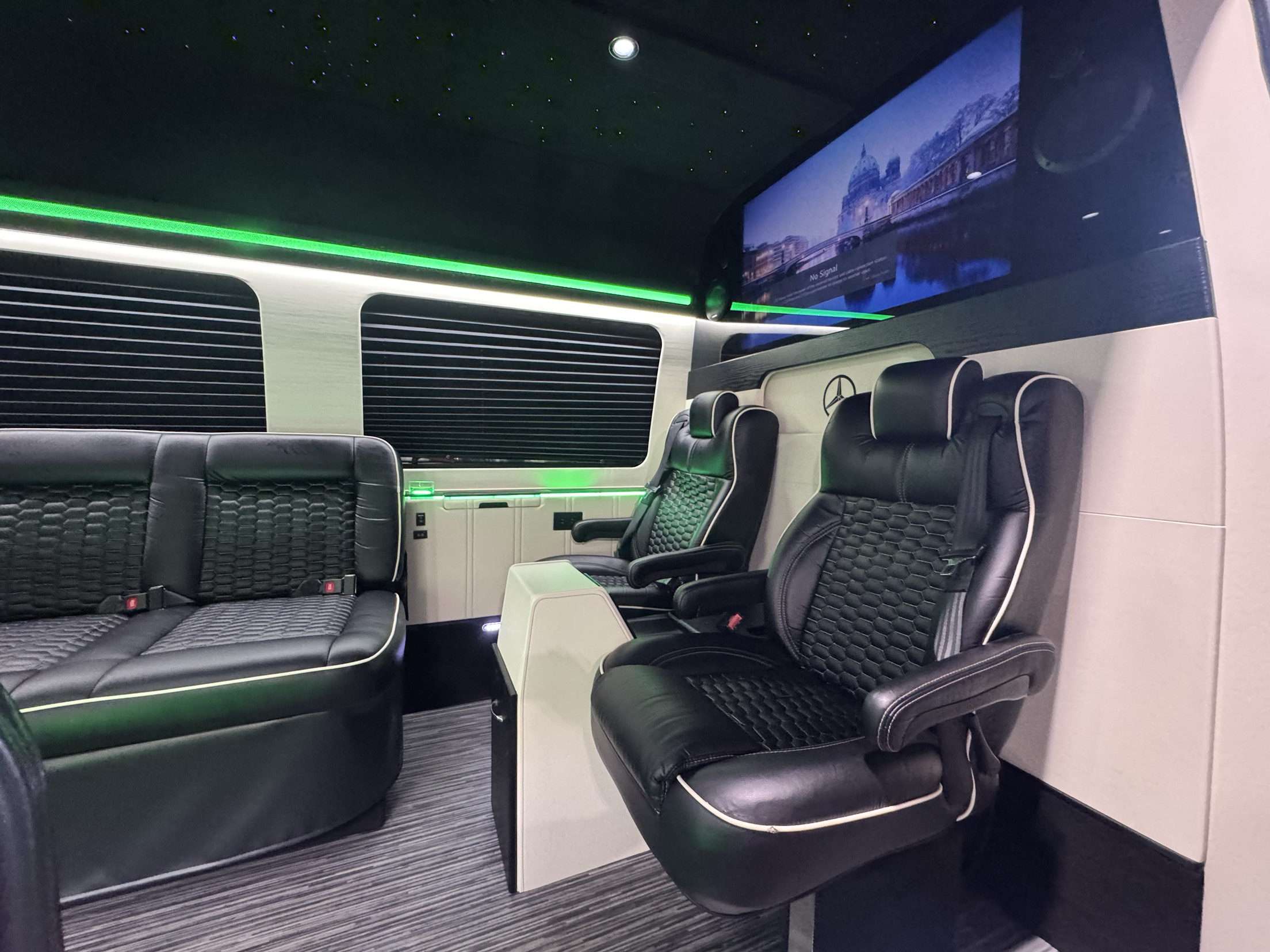Mercedes-Benz Sprinter interior with leather captain's chairs and rear bench — Precise Luxury Limo Service, Minneapolis MN